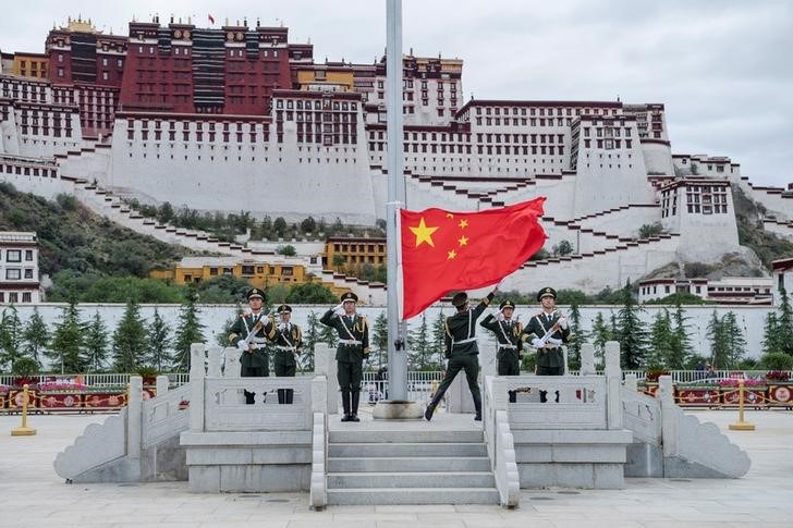 The Chinese national flag is raised during a ceremony marking the 96th anniversary of the founding of the Communist Party of China (CPC) at Potala Palace in Lhasa in July 2017. Credit: Reuters/CNS/He Penglei